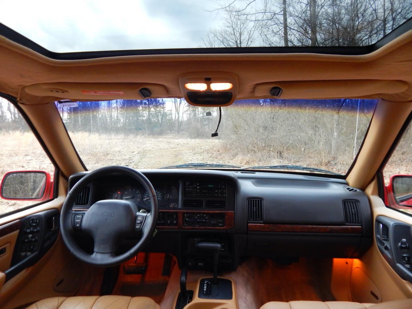 1996 RED /Tan Leather Jeep Grand Cherokee Limited 4WD (1J4GZ78Y6TC) with an 5.2L V8 OHV 16V engine, 4-Speed Automatic Overdrive transmission, located at 6528 Lower York Road, New Hope, PA, 18938, (215) 862-9555, 40.358707, -74.977882 - Here we have a 1996 Jeep Grand Cherokee with a 5.2L V8 putting power to a 4x4 automatic transmission. Options include: tan leather with wood trim, heat/AC, AM/FM/CD/TAPE radio, tilt steering wheel, cruise control, heated front seat, moon roof, power windows/locks/mirrors, roof rack, fog lights, tow - Photo#17